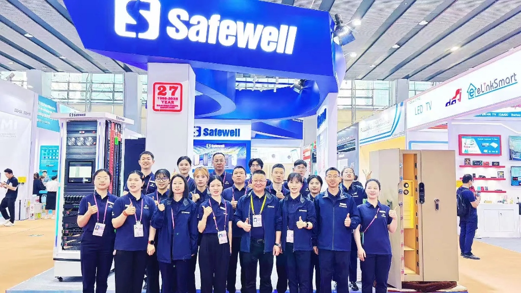 Customer discussions at Safewell exhibition booth